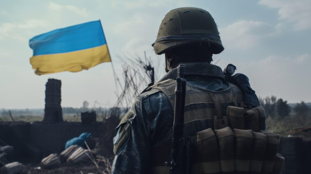 A Ukrainian soldier in combat gear overlooking a devastated urban area with a Ukrainian flag in the background.